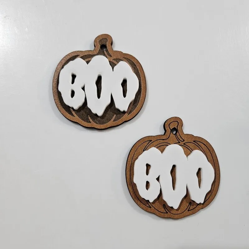 Pumpkin name tag made with cherry plywood and white acrylic